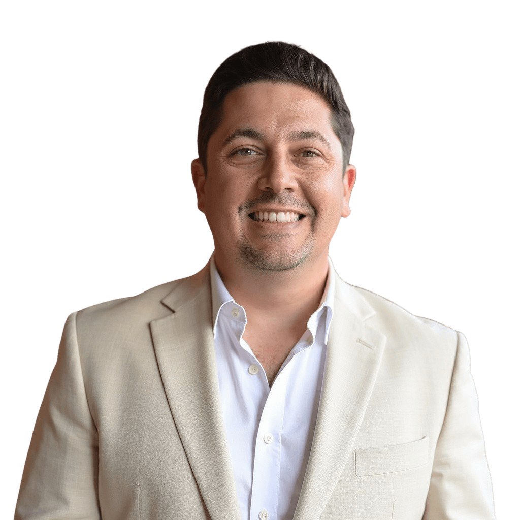 Austin Camp, Co-Founder and CEO of CAGnite, smiling in a light blazer, representing leadership and growth in marketing systems.