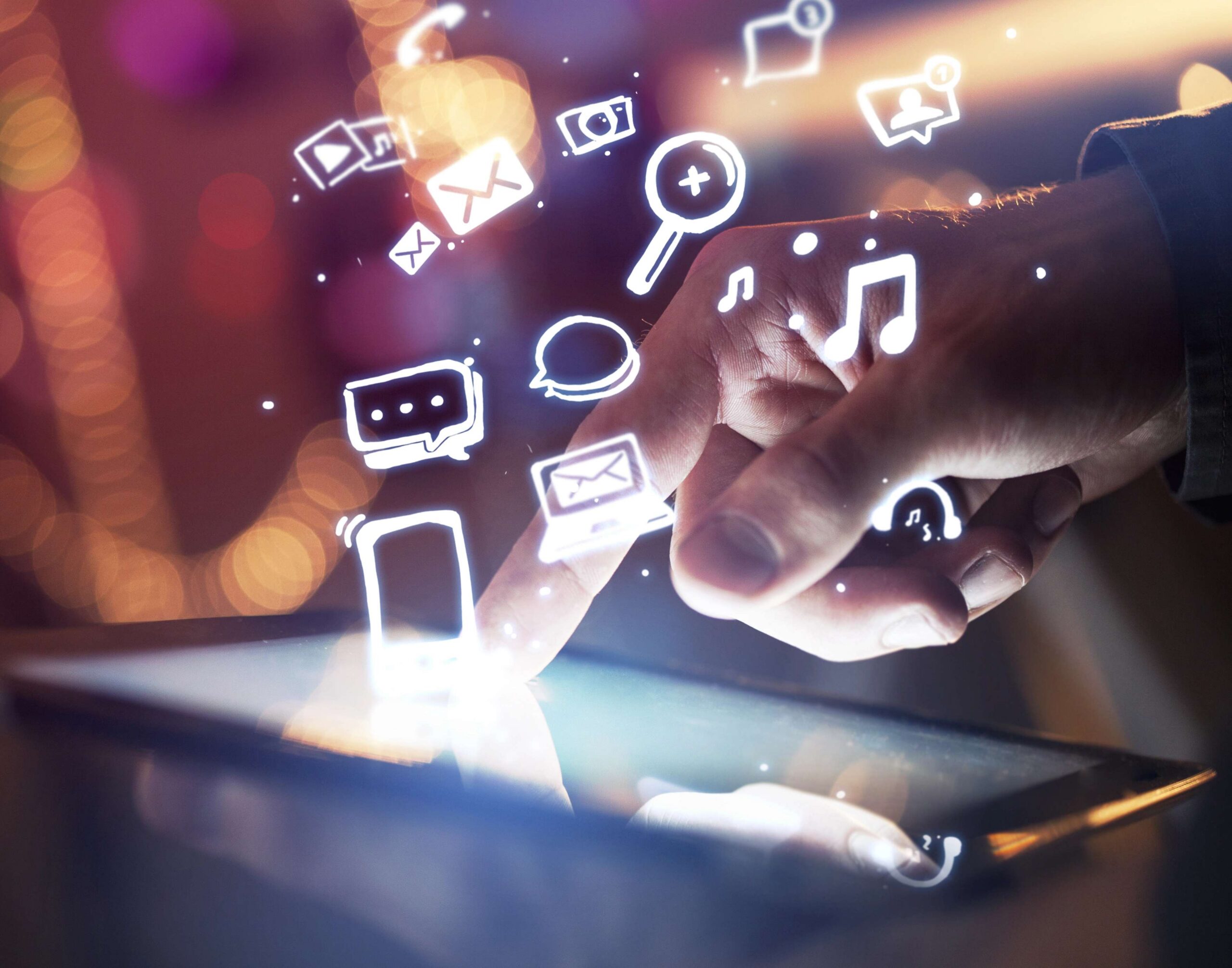 Hand interacting with a tablet, surrounded by digital icons representing social media, communication, and multimedia, emphasizing brand engagement and marketing strategies.