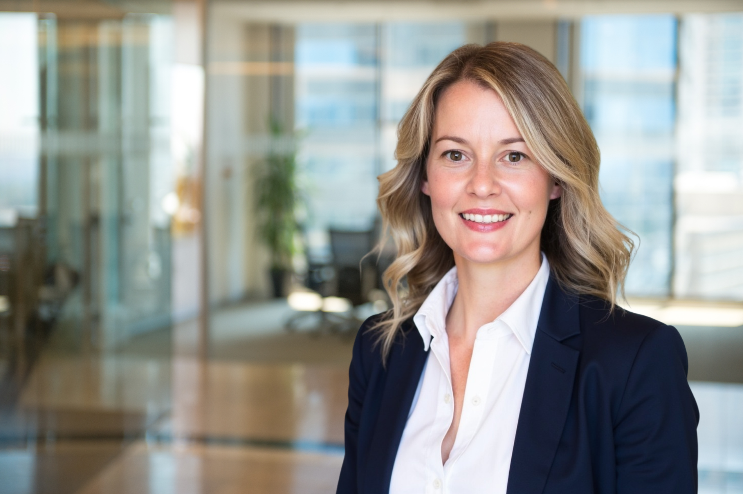 Kaitlin Gagnon, Co-Founder and CCO of CAGnite, smiling in a bright, modern office.